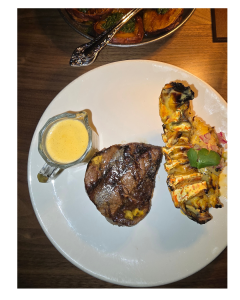 Cooked steak and lobster on plate